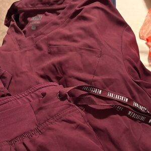 Med Couture Women’s Maroon Joggers and 1 pocket top.